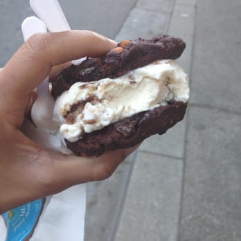 CREAM - banana walnut ice cream, with chunks of walnuts inside, between soft chocolate turtle deluxe cookies that has chunks of caramel - Desserts Near Me - Berkeley, California
