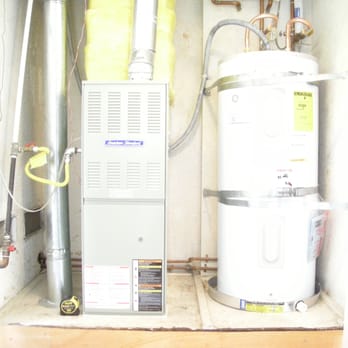 Anthony's Reliable Heating and Air Conditioning - Electric Water Heater and Upflow Gas Furnace in Closet. side by side - Heating & Air Conditioning/HVAC Near Me - Fullerton, California Anthony's Reliable Heating and Air Conditioning - Electric Water Heater and Upflow Gas Furnace in Closet. side by side - Heating & Air Conditioning/HVAC Near Me - Fullerton, California