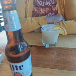 Miller Lite & Caught in the Rain Drink. This drink had Rumhaven, Coconut Rum, Orange, and pineapple Juice with Coconut Cream. Miller Lite & Caught in the Rain Drink. This drink had Rumhaven, Coconut Rum, Orange, and pineapple Juice with Coconut Cream.