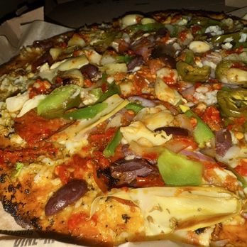 Blaze Pizza - Closeup of the Cauliflower crust. The crust was so good, didn't even miss the regular bread crust. - Salad Near Me - Rialto, California