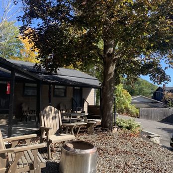 Union + Post - a patio with chairs and a fire pit - American Near Me - Windham, New York