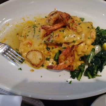Pappadeaux Seafood Kitchen - Atlantic Salman Alexander with collard greens and turnips - Cajun/Creole Near Me - Austin, Texas Pappadeaux Seafood Kitchen - Atlantic Salman Alexander with collard greens and turnips - Cajun/Creole Near Me - Austin, Texas
