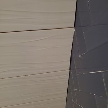 Escobar Flooring - Pro tiler wouldn't tile over wavy wall. Destroys the balance. - General Contractors Near Me
