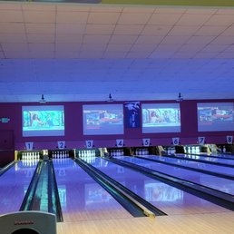 a bowling alley with bowling lanes a bowling alley with bowling lanes