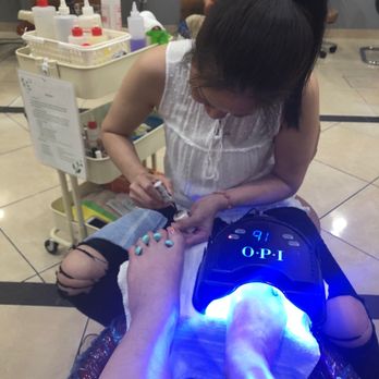 Nail Bar & Spa - Holly hard at work with 3 X shellac and black light. No smudging. - Nail Salons Near Me - Austin, Texas