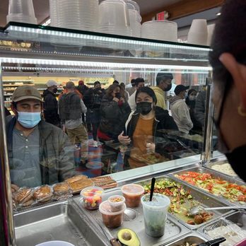Caribe Mini Market - a man wearing a face mask - Convenience Stores Near Me - Patchogue, New York