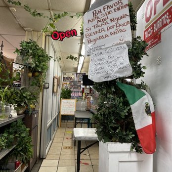 El Rinconcito - a sign in a store - Mexican Near Me - Carson, California