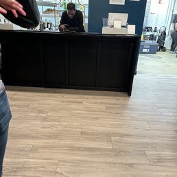 Employees playing around and on their phones Employees playing around and on their phones