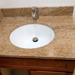 Granite vanity top with back and side splashes.