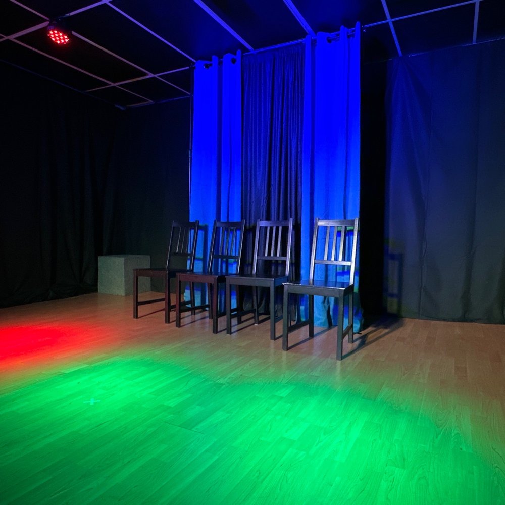 Impro Theatre - a set of chairs with colored lights - Performing Arts Near Me - Los Angeles, California