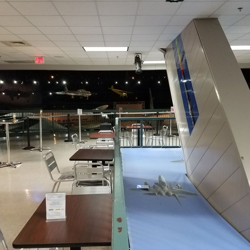 Refuelling Cafe - a table with chairs and a plane in the background - Themed Cafes Near Me - Riverside, Ohio