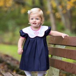 Just Add Embroidery - Precious little model showcasing our Queen City monogram...