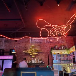 a man sitting at the bar a man sitting at the bar