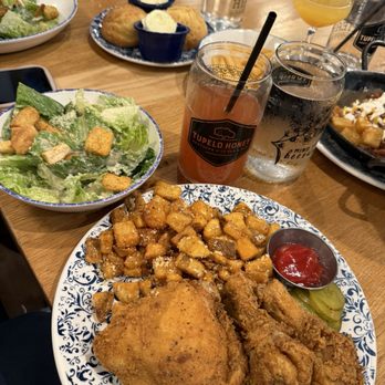 Tupelo Honey Southern Kitchen & Bar - 2 piece BONE IN fried chicken w/ Parmesan & Rosemary breakfast potatoes! With a Caesar side salad! - Southern Near Me - Charlotte, North Carolina Tupelo Honey Southern Kitchen & Bar - 2 piece BONE IN fried chicken w/ Parmesan & Rosemary breakfast potatoes! With a Caesar side salad! - Southern Near Me - Charlotte, North Carolina