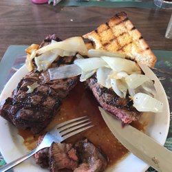 Bob's Steakhouse - Steak "sandwich" 14 oz with sautéed onions. Comes with Texas toast. Perfectly cooked med rare.