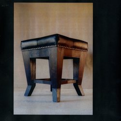 bLue xYlem - The design of this pouffe was inspired by the cubism art movement.
Each leg is made of a single piece of solid wood. Upholstered with black