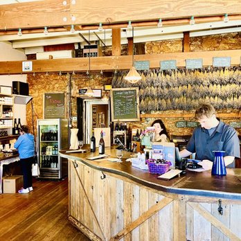 Lavender Ridge Vineyard - a man and a woman at the counter - Wine Tasting Room Near Me - Murphys, California
