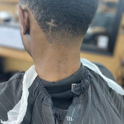 D Men’s Barbershop - Bald taper with cross design
Haircut by: Xavier