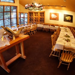 The Venue - Floor-to-ceiling windows with forested mountain views.