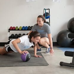 Chapel Hill Training - Owner, Lauren Cruz, training a client toward achieving her strength building goals.