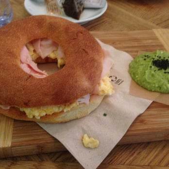 Brunch & Cake - Yummy and huge bagel sandwich with turkey and egg. - Breakfast & Brunch Near Me - Barcelona, B Brunch & Cake - Yummy and huge bagel sandwich with turkey and egg. - Breakfast & Brunch Near Me - Barcelona, B