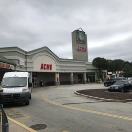 a parking lot with cars parked in front of it