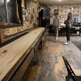 diamond inn bar - a shuffle table in the middle of the room - Bars Near Me - Denio, Nevada