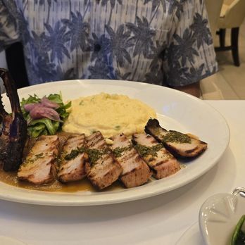 Shula's Steak House - Pork chops with jalapeno cheese grits - Steakhouses Near Me - Gainesville, Florida Shula's Steak House - Pork chops with jalapeno cheese grits - Steakhouses Near Me - Gainesville, Florida