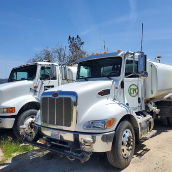 Chad Pankey Construction - two trucks parked in a field - Fences & Gates Near Me Chad Pankey Construction - two trucks parked in a field - Fences & Gates Near Me