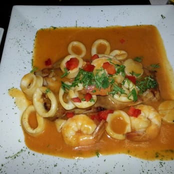 Oh! Calamares - Pan seared groupa filet covered in spicy red sea food sauce.  perhaps the most fresh fish in all of new jersey - Peruvian Near Me - Kearny, New Jersey