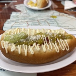 Classic Sonoran hot dog with my terrible sauce skills where I unevenly out avocado sauce and sals verde.