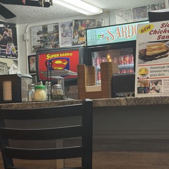 Super Sardo's Pizza - Cool Superman logos. - Pizza Near Me - Largo, Florida