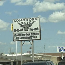 Long Horn Cafe - Sign and packed parking lot.