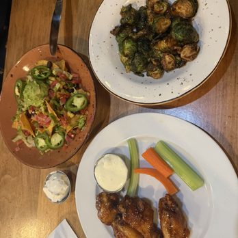 Busboys and Poets - Chili sauce wings, mini nachos, Brussel sprouts - Breakfast & Brunch Near Me - Arlington, Virginia