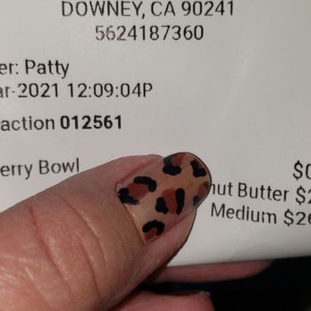 Mangos frozen yogurt - a hand holding a business card - Acai Bowls Near Me - Downey, California