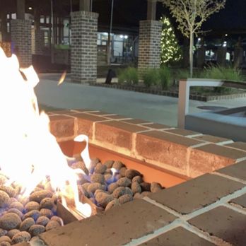 Sun Outdoors Myrtle Beach - Gas fire pits by the pool and daybed swings in the background - Campgrounds Near Me - Conway, South Carolina Sun Outdoors Myrtle Beach - Gas fire pits by the pool and daybed swings in the background - Campgrounds Near Me - Conway, South Carolina