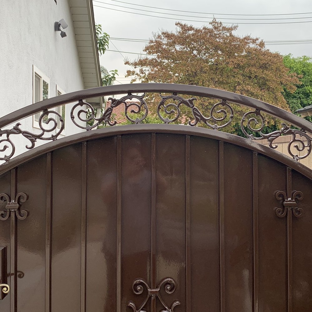 Fence R Us - Closer look at the detail work of the decor at the top of the gate. - Fences & Gates Near Me - Montclair, California Fence R Us - Closer look at the detail work of the decor at the top of the gate. - Fences & Gates Near Me - Montclair, California