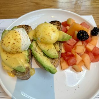Sixty Vines - Avocado Eggs Benedict with sliced avocados - Wine Bars Near Me - Houston, Texas