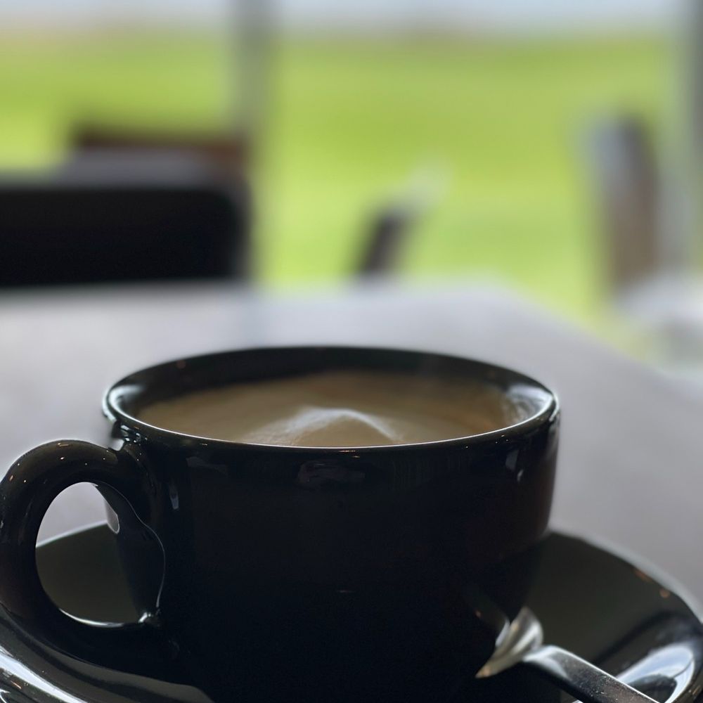 Panorama Restaurant - a cup of coffee on a table - Seafood Near Me - Inverness, Nova Scotia Panorama Restaurant - a cup of coffee on a table - Seafood Near Me - Inverness, Nova Scotia