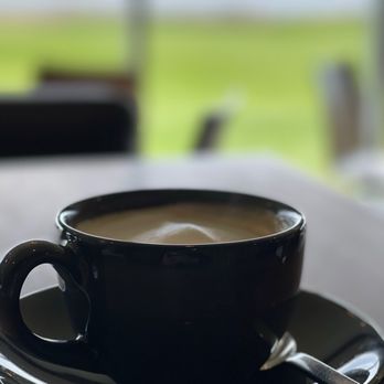 Panorama Restaurant - a cup of coffee on a table - Seafood Near Me - Inverness, Nova Scotia