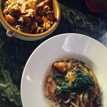 Martina - Top: roasted carrots with salmoriglio and farro. Bottom: spaghetti fra diavolo with lobster. Carrots were okay, spaghetti was very good! - Argentine Near Me - Minneapolis, Minnesota