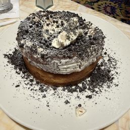 Cookies and Cream Cinnamon roll prepared tableside Cookies and Cream Cinnamon roll prepared tableside