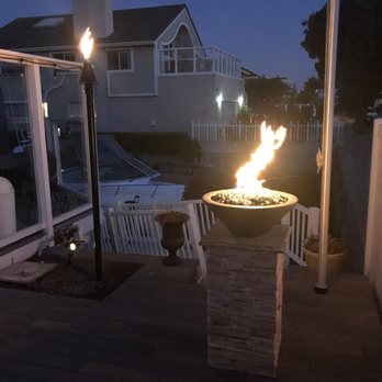 Outdoor Fire and Patio - Both the Black cone gas Tiki Torch with Aluminum powder coated black poles, and 24" Cazo Fire Bowl in Natural Grey. - Outdoor Furniture Stores Near Me