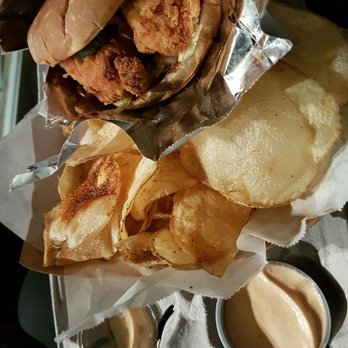 LudoBird - Spicy chicken sandwich with housemade chips and a bottle of water - New American Near Me - Los Angeles, California LudoBird - Spicy chicken sandwich with housemade chips and a bottle of water - New American Near Me - Los Angeles, California