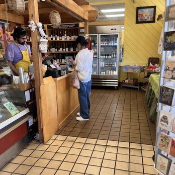 Uppercrust Productions - Uppercrust Bakery -  cards, small gifts available in the front window, cold drinks in the cold case. - Bakeries Near Me - Gainesville, Florida
