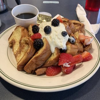 Hubbard Avenue Diner - Traditional french toast: three pieces with berries and cream. - New American Near Me - Middleton, Wisconsin Hubbard Avenue Diner - Traditional french toast: three pieces with berries and cream. - New American Near Me - Middleton, Wisconsin