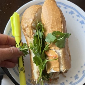 Photo of Bun & Mi - Santa Monica, CA, United States. It's a large sandwich. Half of the sandwich and highlighter for scale!