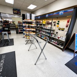Gervic Auto Body Supply - Automotive paint and body supply store interior featuring organized shelves of PPG products, spray cans, tools, accessories, ...