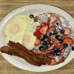 The Morning Griddle Cafe - Pancake with strawberry,blueberry bacon & Eggs