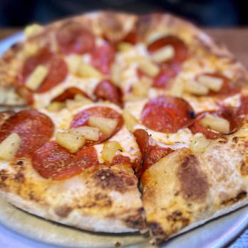 Old Chicago Pizza + Taproom - Individual sized; Ale crust pepperoni and pineapple. - Sports Bars Near Me - Casper, Wyoming Old Chicago Pizza + Taproom - Individual sized; Ale crust pepperoni and pineapple. - Sports Bars Near Me - Casper, Wyoming